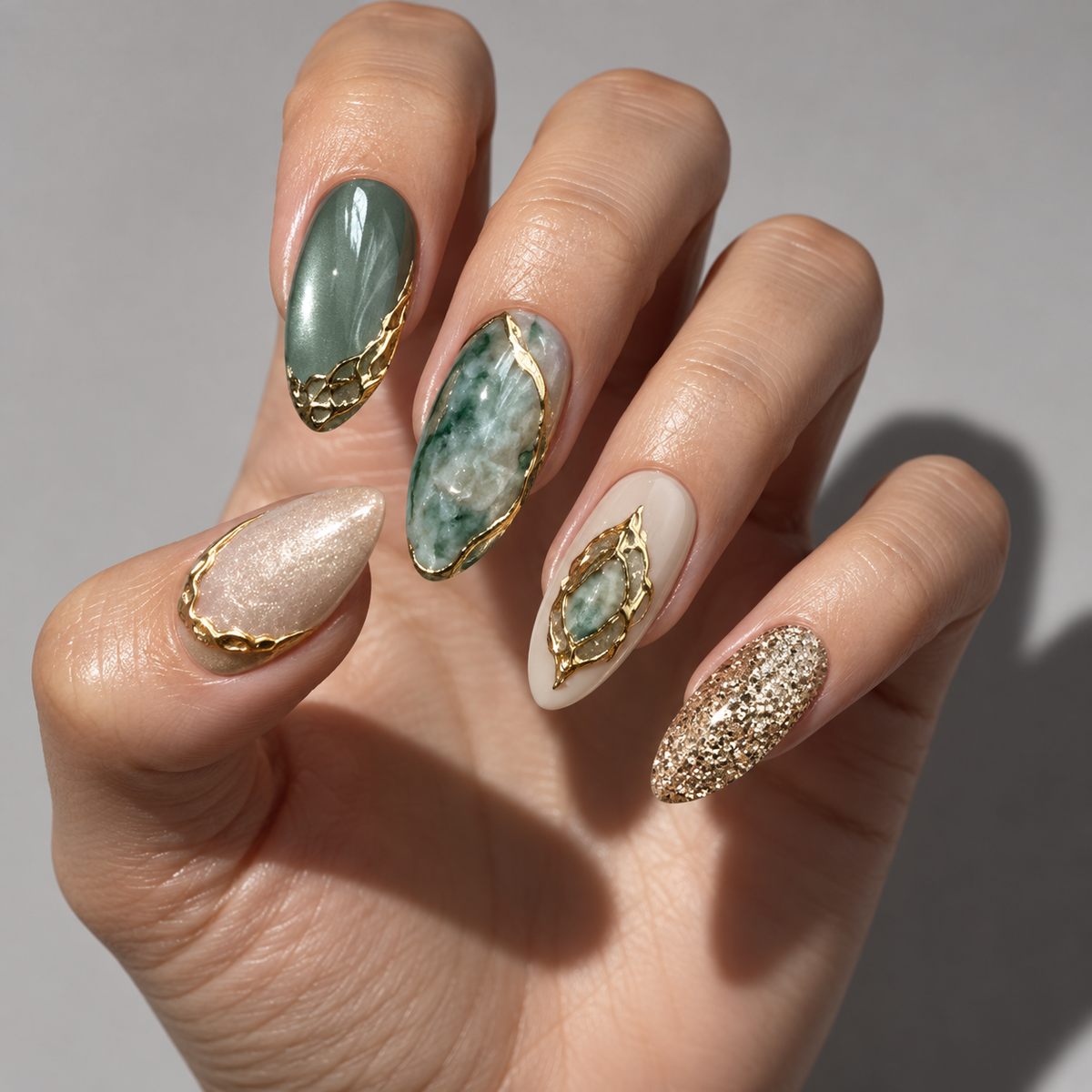 Sculptural jade and gold nail art